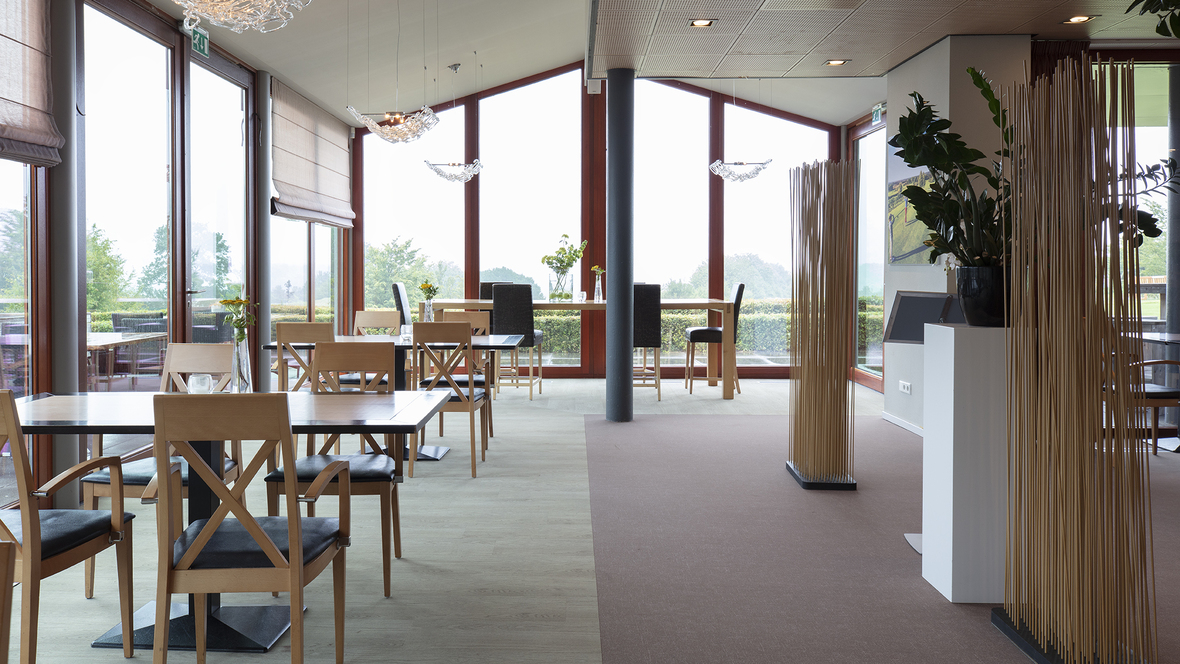 Restaurtant tables on woodlook and brown floor, Golfclub Rijk van Margraten
